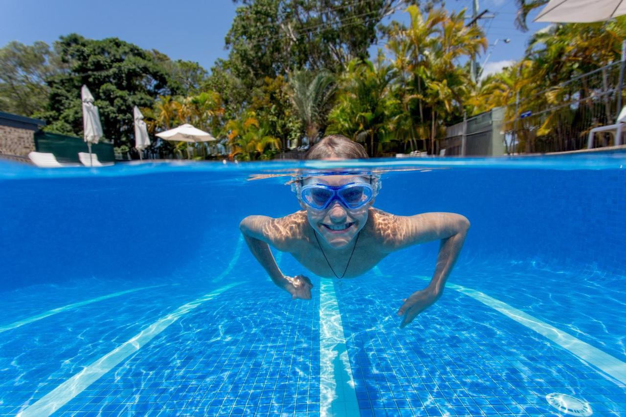 A kid swimming in the pool at Ingenia Holidays noosa North