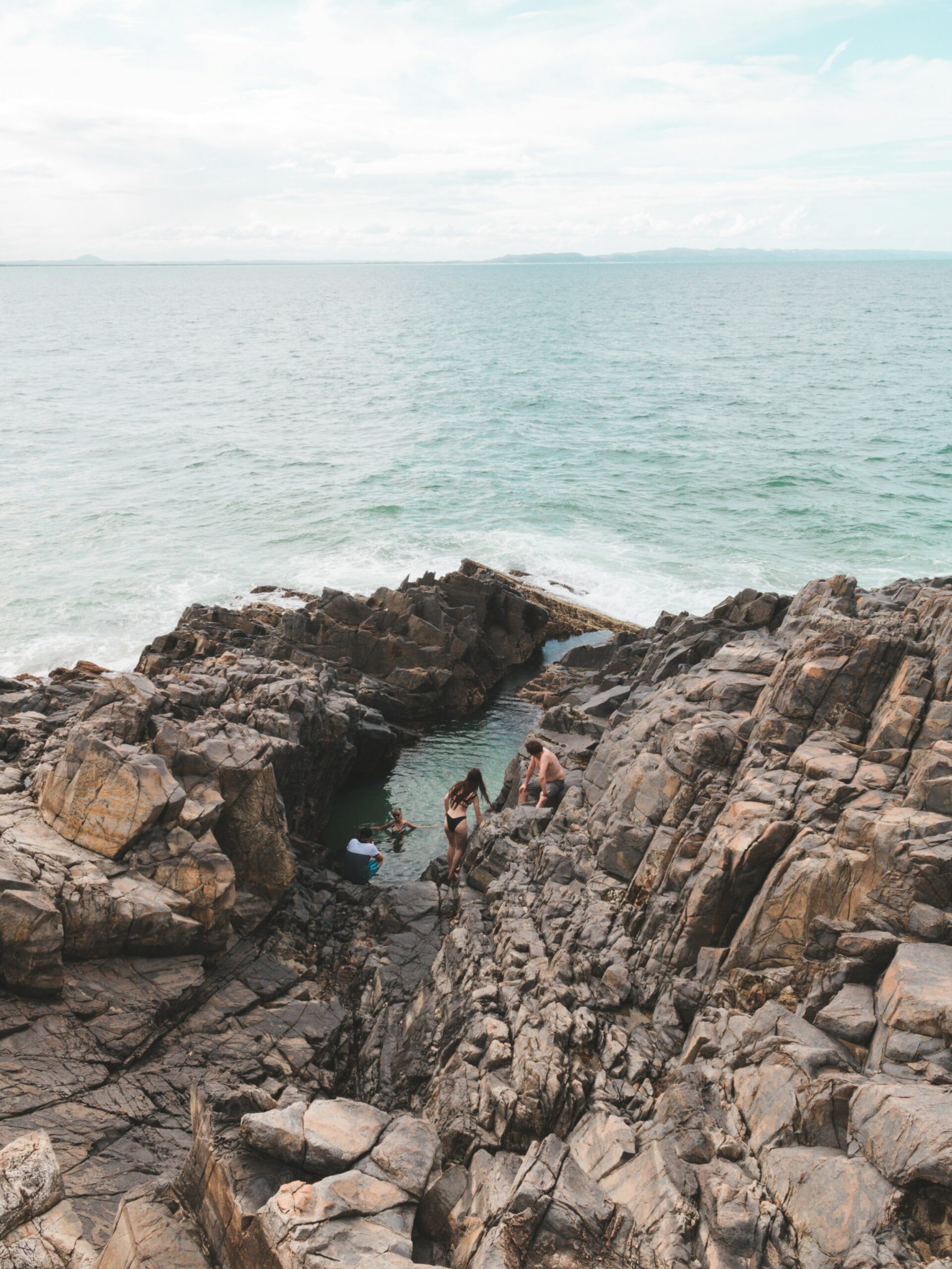 People Swimming and about to get in the Fairy Pools Noosa