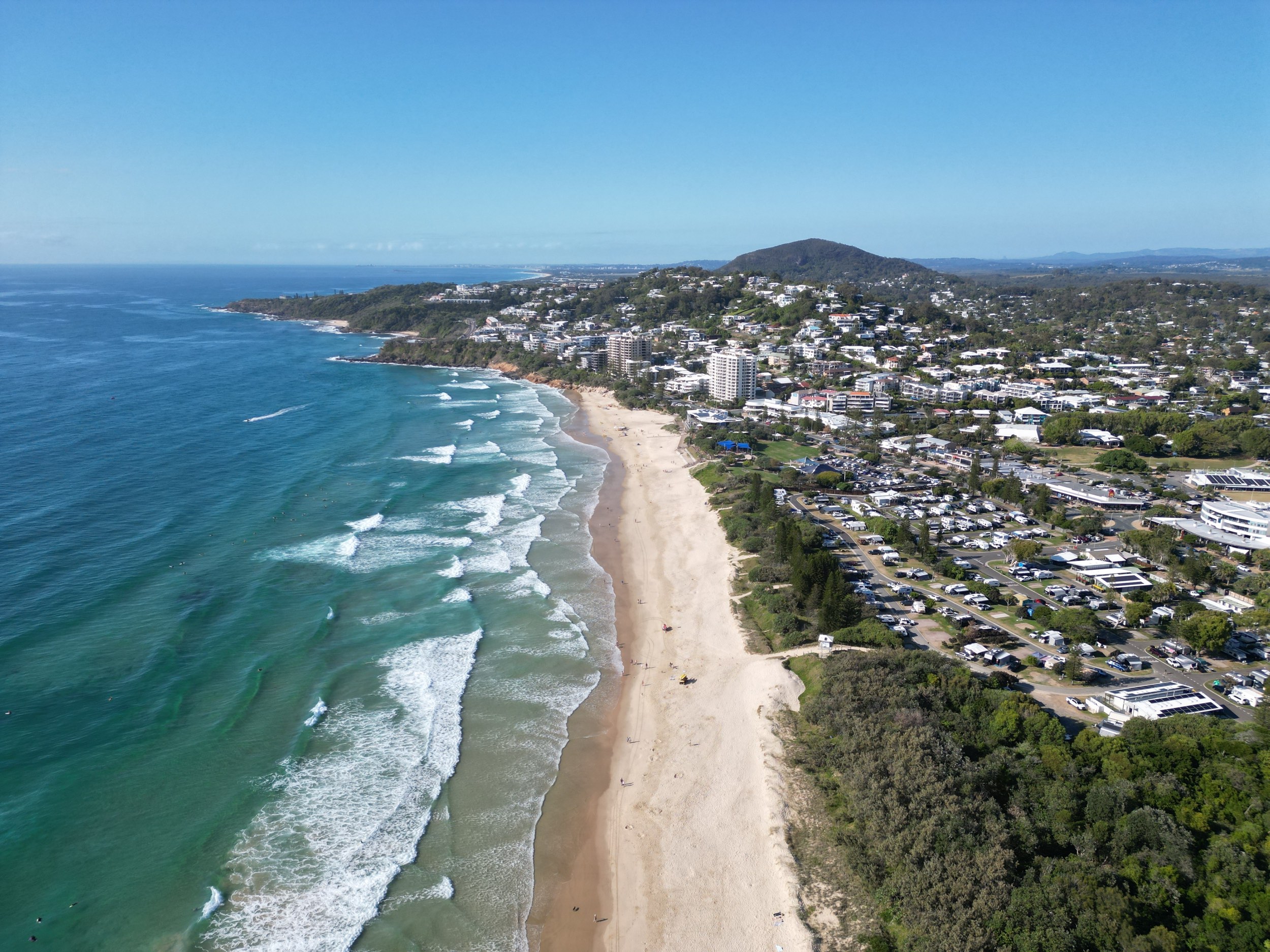 Aerial, drone view of the amazing Coolum Beach on the Sunshine Coast north of Brisbane Queensland Australia. Beautiful beachfront with breaking ocean waves.