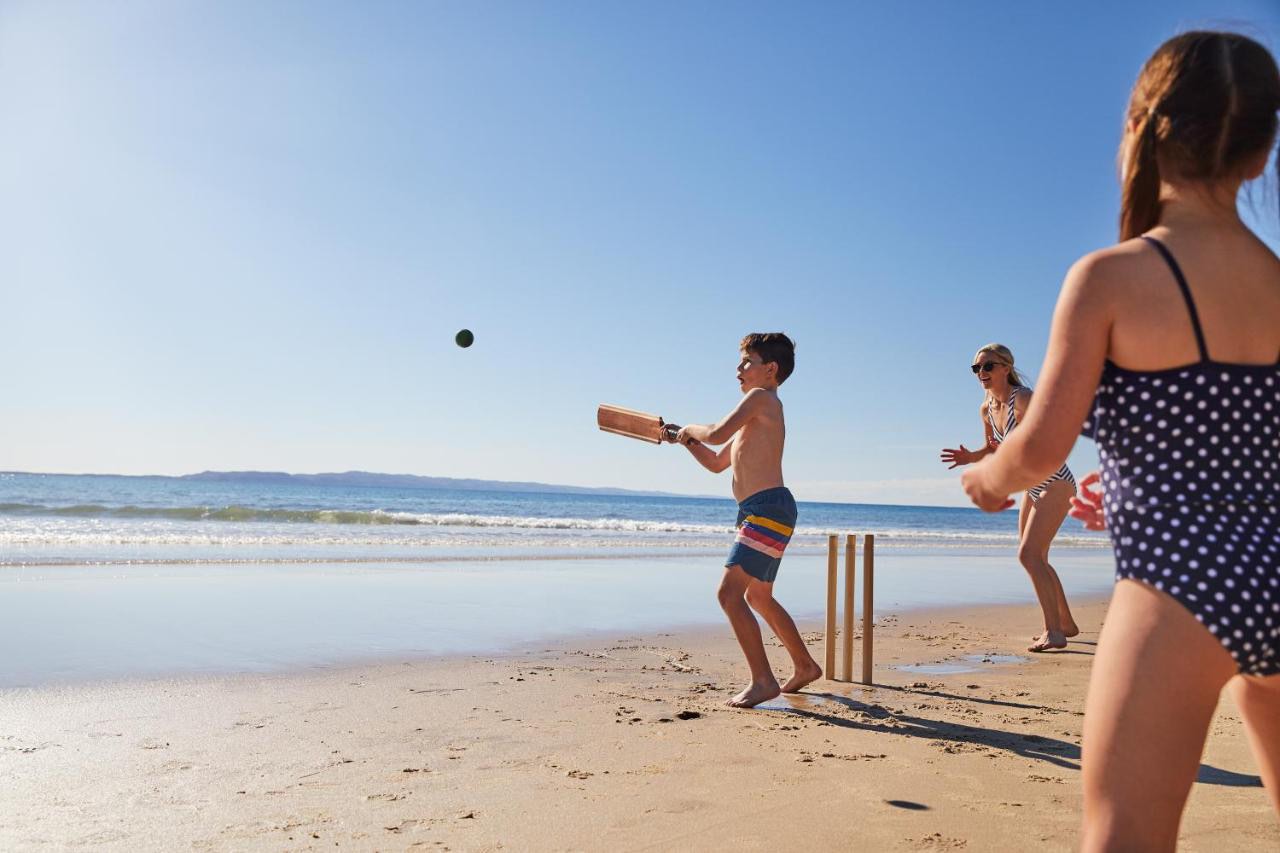 Family having fun on Noosa Main Beach